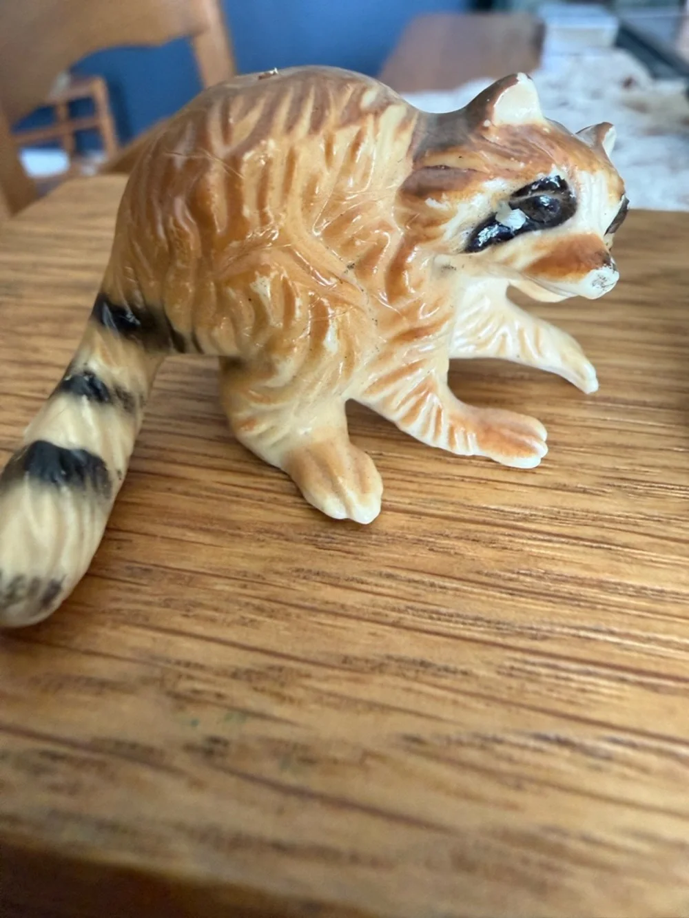 Mini pair of raccoon figurines